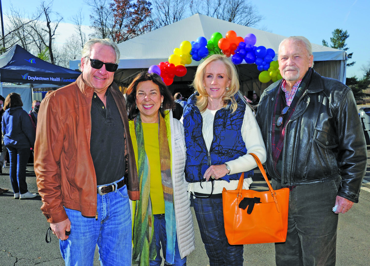 Dr. Scott Levy, Joy Levy, and Sarah and Scott Moyer, outdoors prior to entering the groundbreaking event tent.