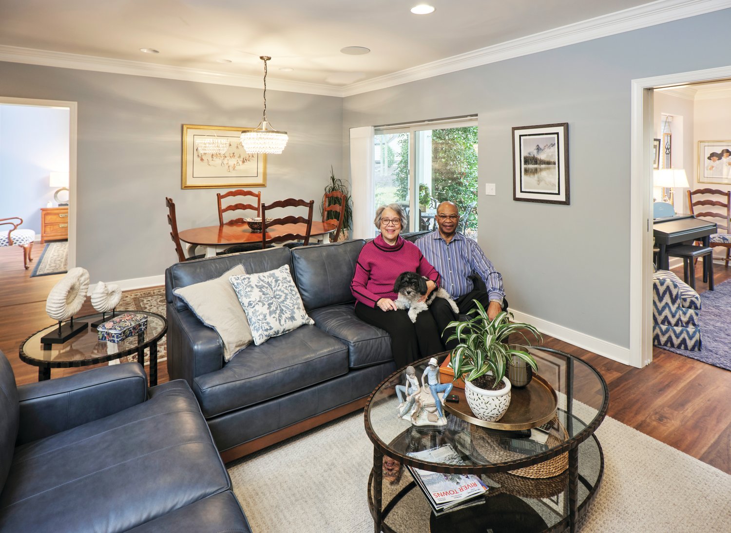 Inez and Norman Bing, with their dog, Bella, in the living room of their airy apartment.