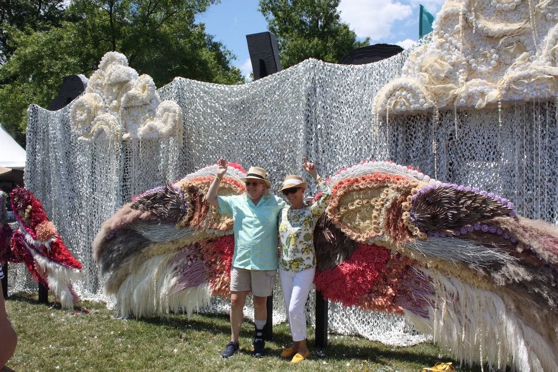 Sisters Karyn Kernagis of Philadelphia and Mary Eileen Perhosky of Haddonfield, N.J., spread their wings at the American Institute of Floral Designers exhibit.