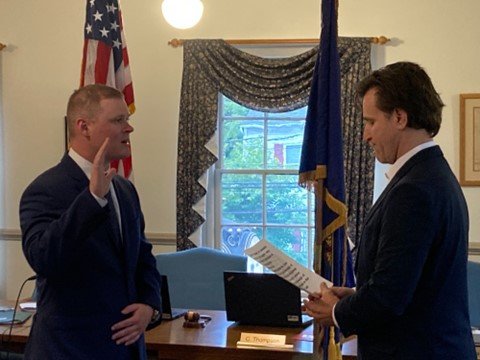 New Yardley Borough parttime police officer Colin Murphy, left, is sworn in by Mayor Chris Harding.