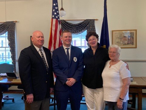 New Yardley Borough parttime police officer Colin Murphy, second from left, stands with, from left, his father Robert, mother Carole and grandmother Patricia Murphy.