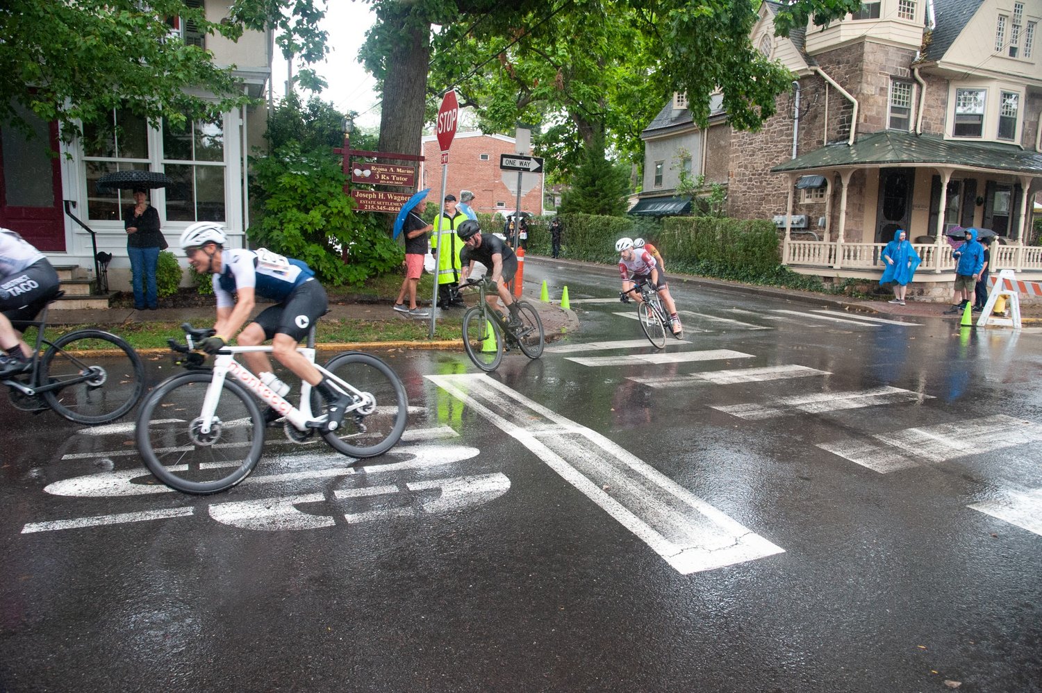 A treacherous turn on a rain-soaked street.