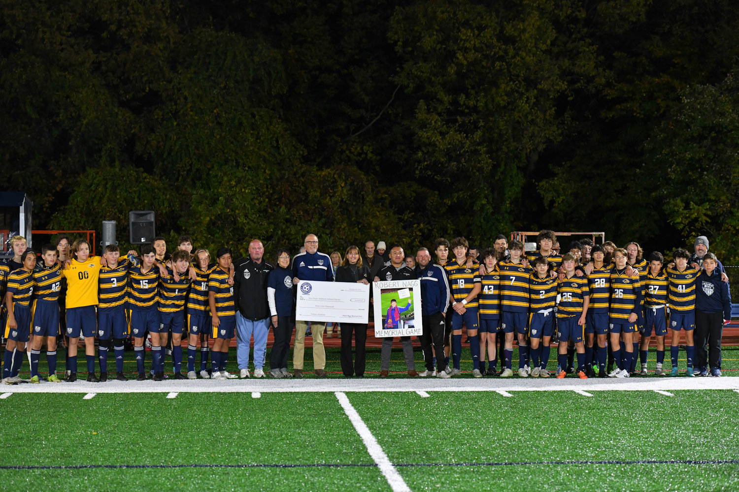 Nan and Dennis Nagg recently presented the final check from the Robert Nagg Memorial Fund to New Hope-Solebury administrators Dr. Rose Minniti, assistant superintendent, and Patrick Sasse, high school
principal. They were joined at the event by the entire boys soccer team.