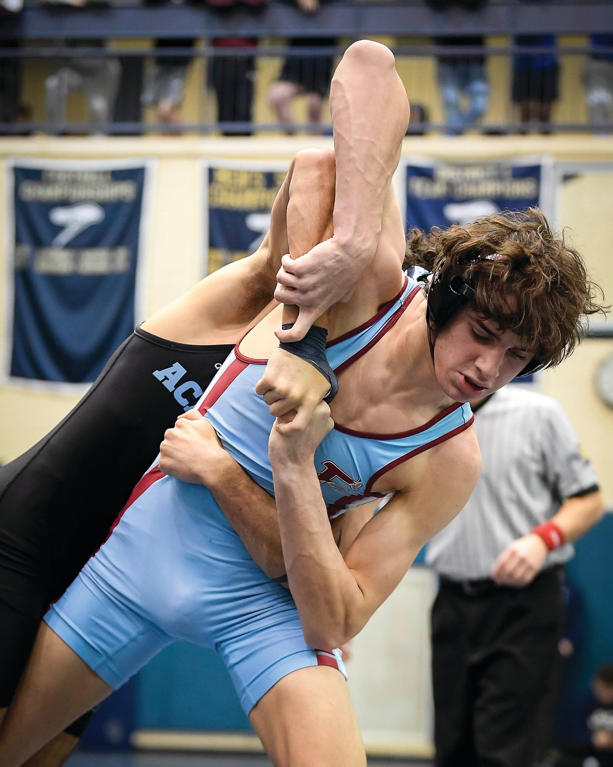 Faith Christian Academy’s Max Stein tries to break the grip of Julian George of Christian Brothers Academy in New Jersey.