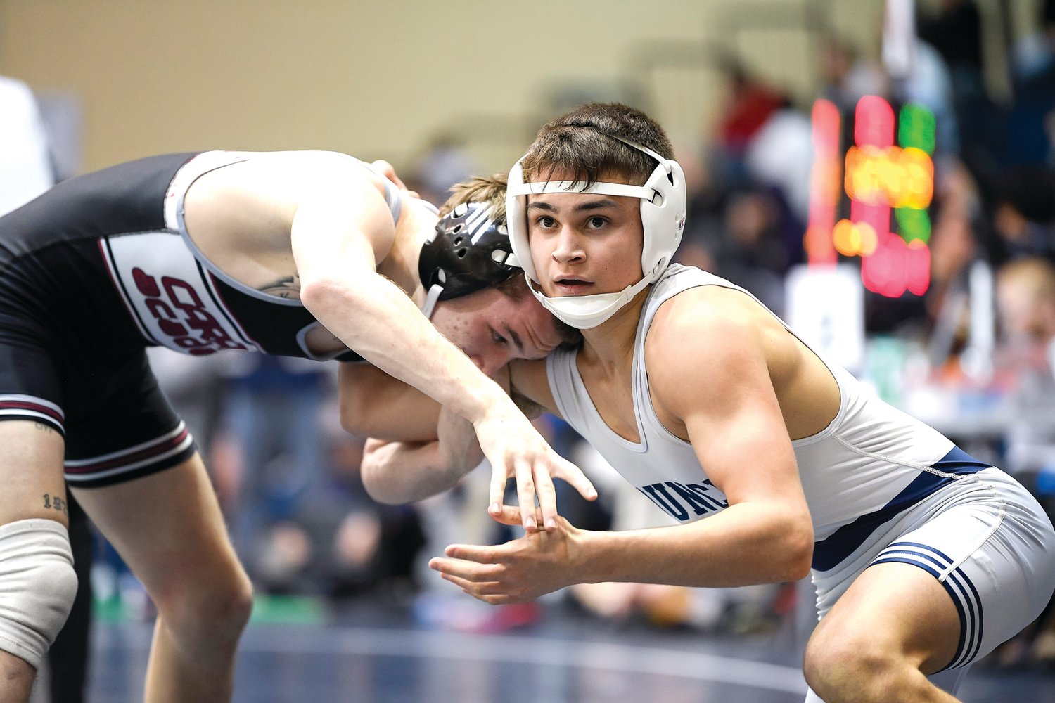 Council Rock North’s Eren Sement checks the clock during his 1-0 loss consolation match against Luke Poore from Caravel Academy.