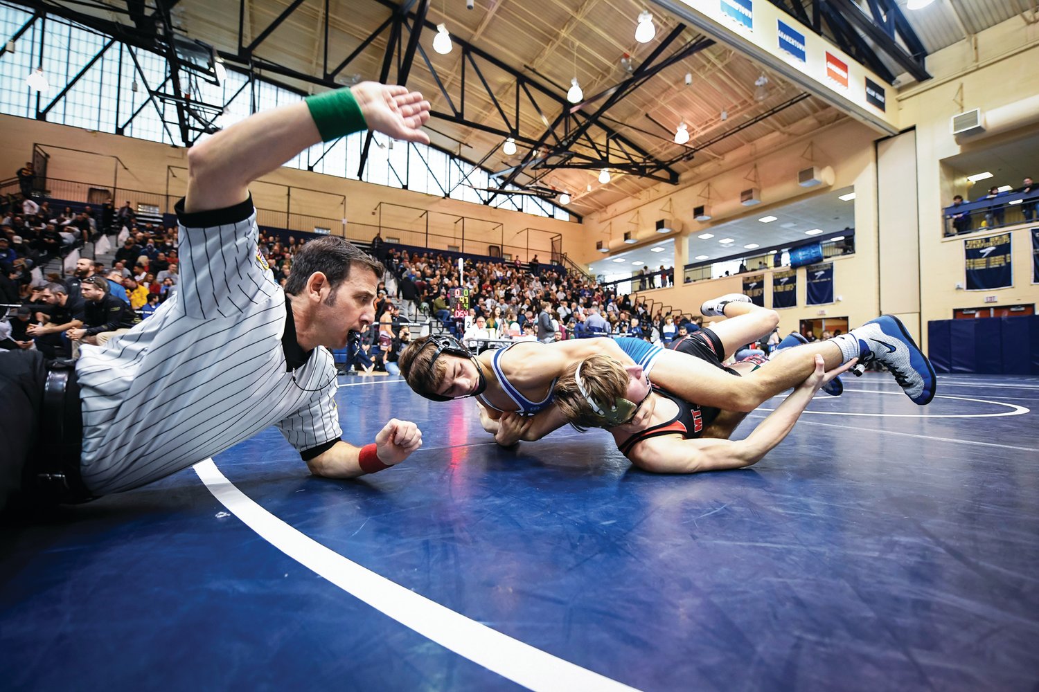 Quakertown’s Mason Ziegler handles Mount Olive’s Matteo Eagleson in a 121-pound match won by Ziegler 15-4. Ziegler would finish third in the 121-pound class.