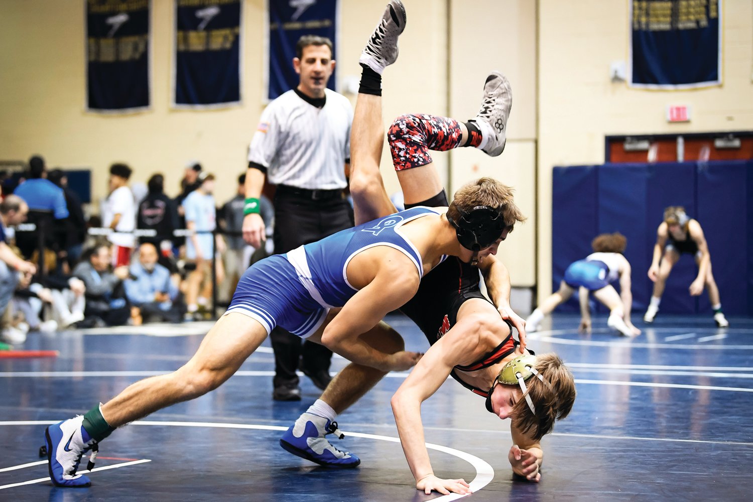 Qakertown’s Mason Ziegler drives Mount Olive’s Matteo Eagleson to the mat.