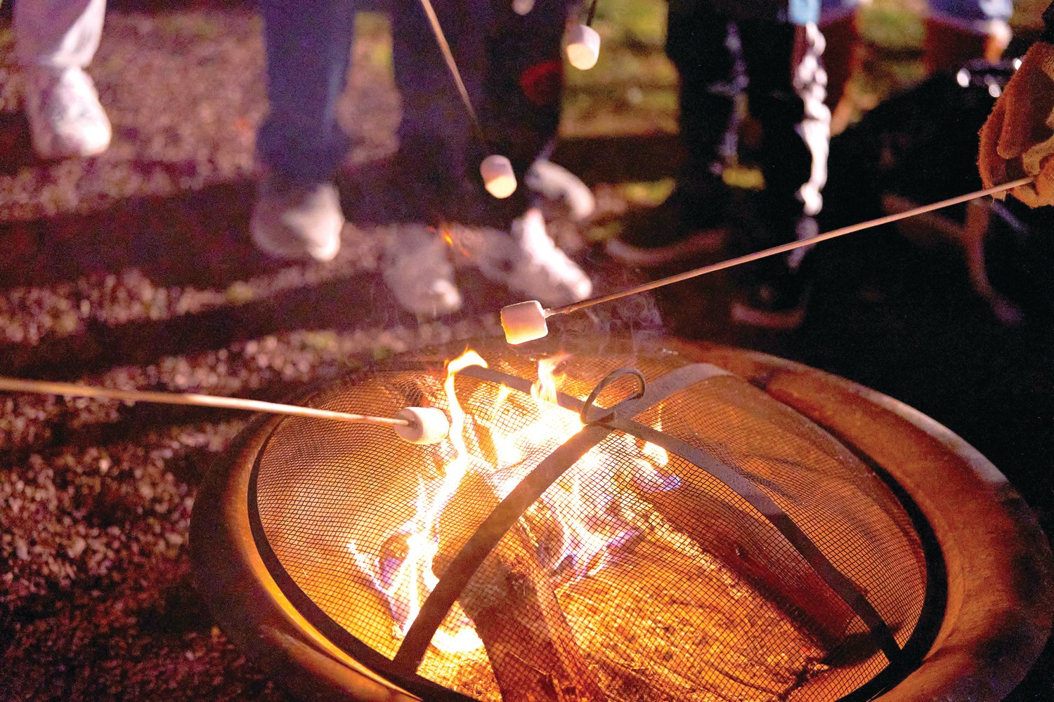 Children roast marshmallows at Bristol’s Mill Street Fire & Ice Event Friday, Jan. 20, 2023 in Bristol Borough.