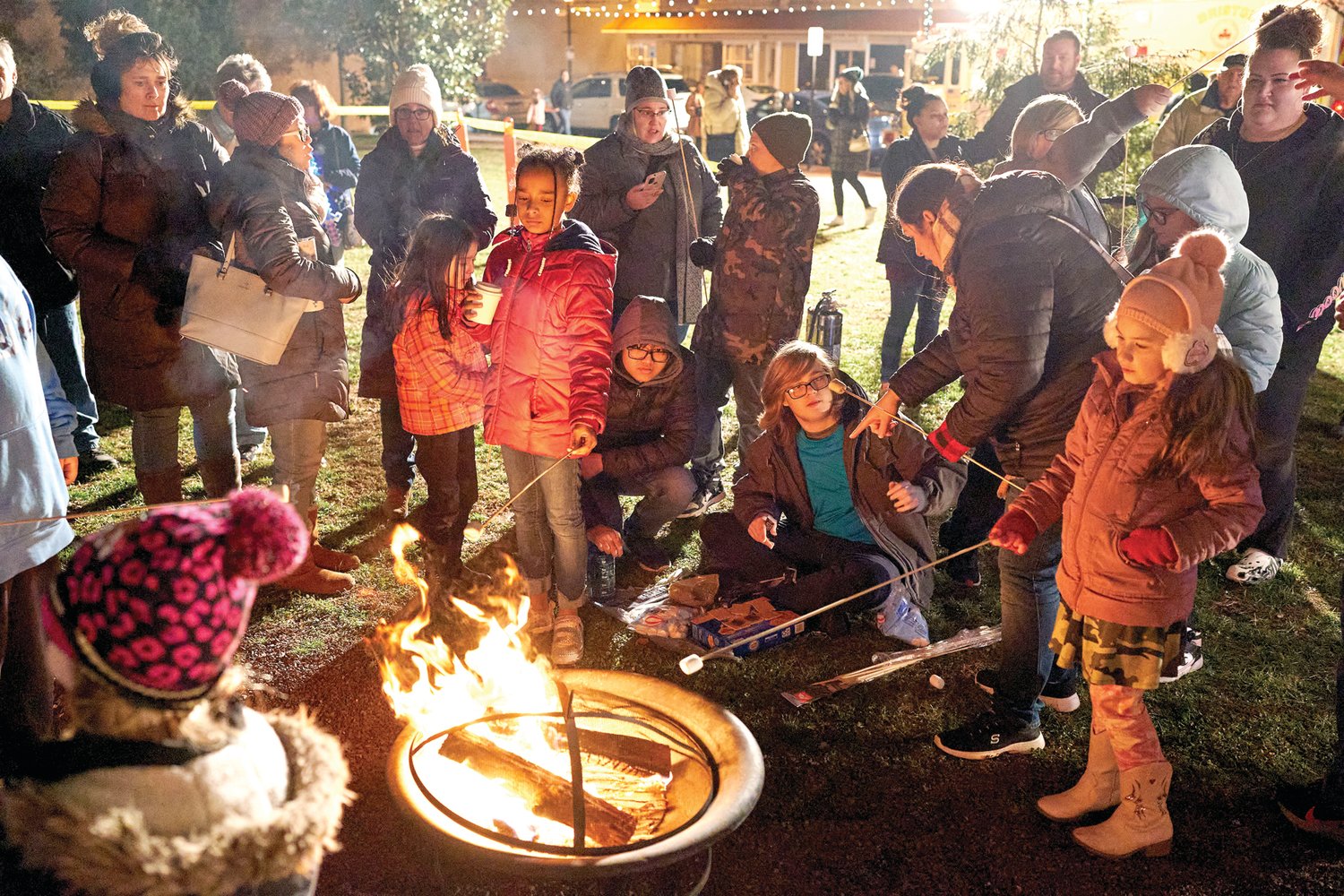 Children roast marshmallows at Bristol’s Mill Street Fire & Ice Event Friday, Jan. 20, 2023, in Bristol Borough.