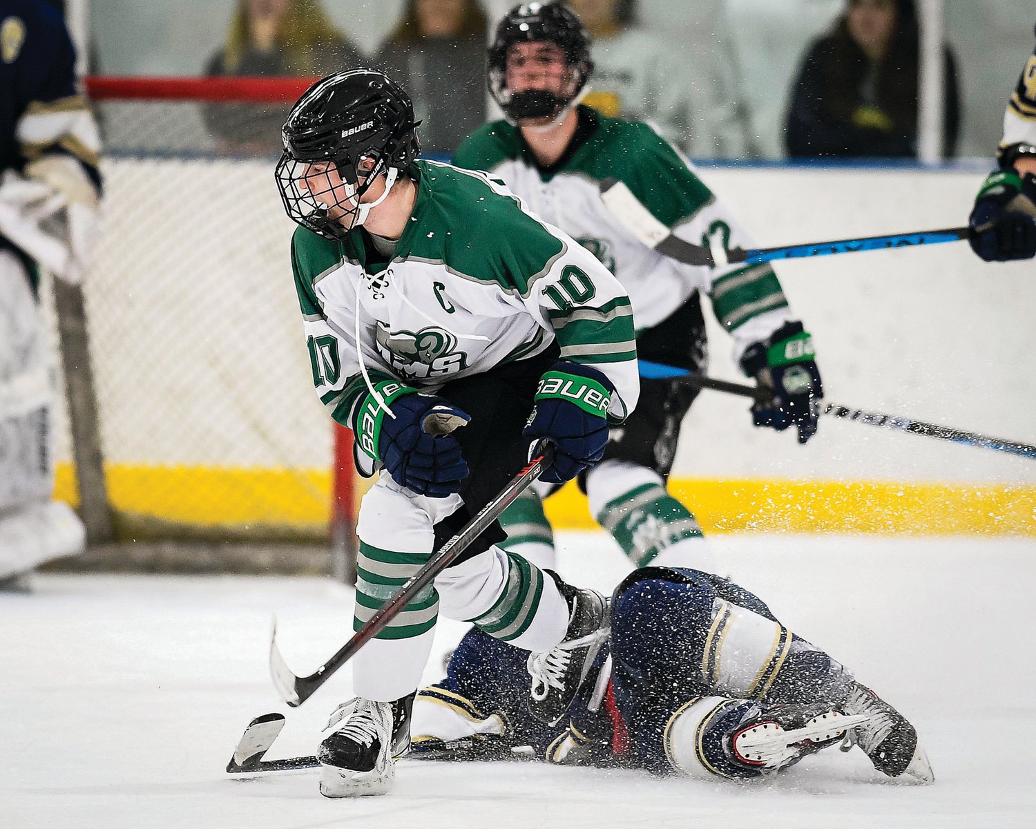 Pennridge’s Colin Dachowski looks for a pass after checking Jake Weiner.