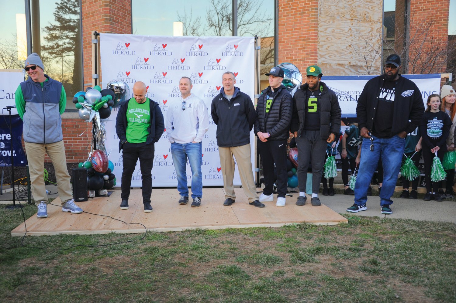 The head coaches from Central Bucks School District’s three high schools (from left: John Donnelly of CB East, Rob Rowan of CB West and Tom Hetrick of CB South) discuss the upcoming matchup between the Eagles and the Kansas City Chiefs along with Delaware Valley University head football coach Duke Greco, as his quarterback Louie Barrios IV and running back Jay White look on. Former Eagles lineman Tra Thomas, right, listens.