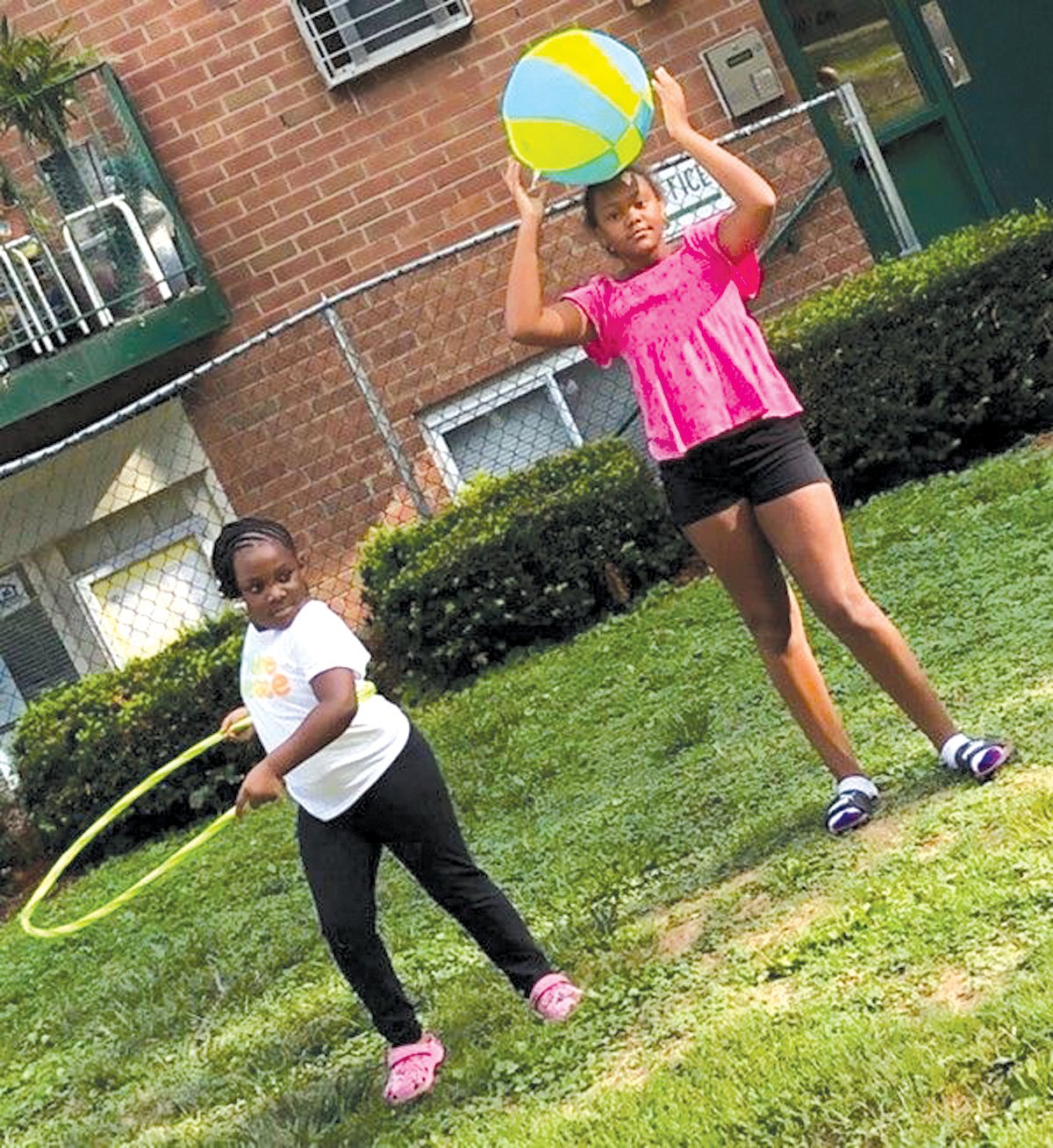 Children living in BCHG housing enjoy fresh air and exercise with new outdoor play equipment.