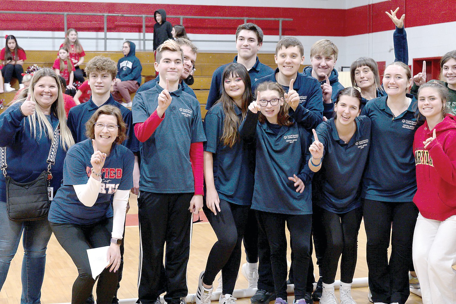 Central Bucks Unified Sports Coach Jen Dougherty, Zack Gelb, Coach Marie DiStefano, Charlie Reimer, Jack Blair, Julia Norris, Tim Reimer, Charlotte Brock, John Tredinnick, Justin Lowe, Sarah Daugherty, Coach Deming, Olivia Samkavitz, Sophia Schorn, and Sienna Valenti celebrate the win.