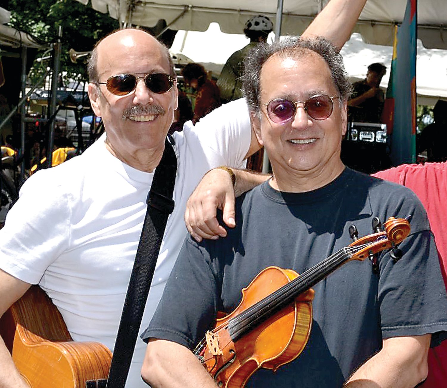 Folk duo David Buskin, left, and Robin Batteau, are leading a crew of folk performers to the Sellersville Theater on April 9, where they’ll focus on the lighter side of music.