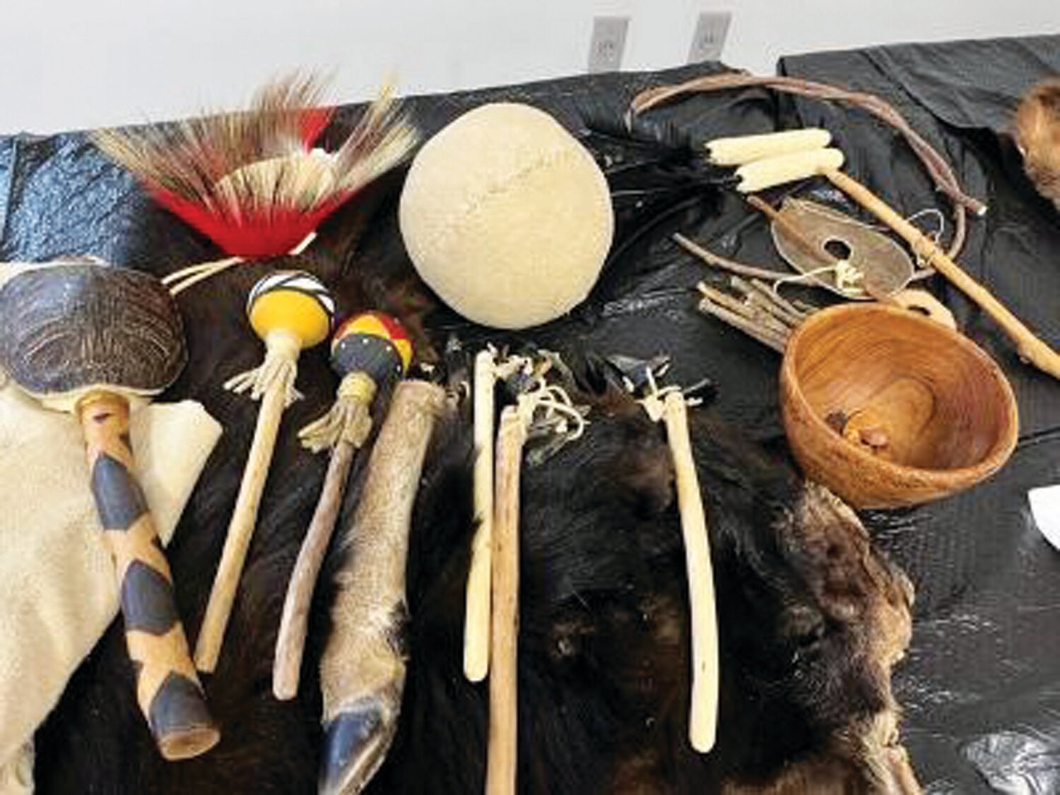 The feathered roach (top left) was a typical Lenape headdress. Musical instruments, tools and weapons were made of animal parts.