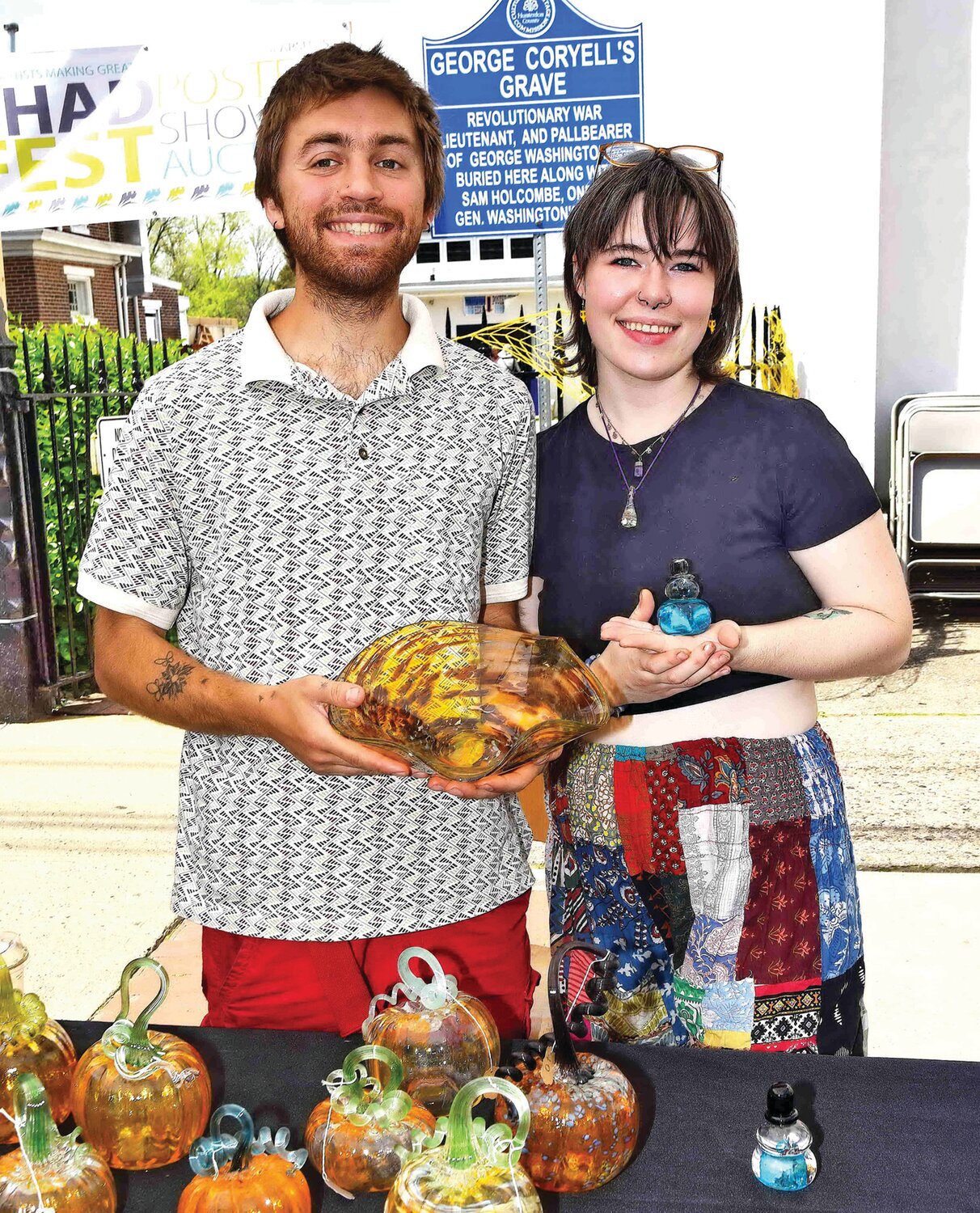 Jarryd Pezzillo and Gwyn Wyckoff show off glass art from Pezz Glassworks.