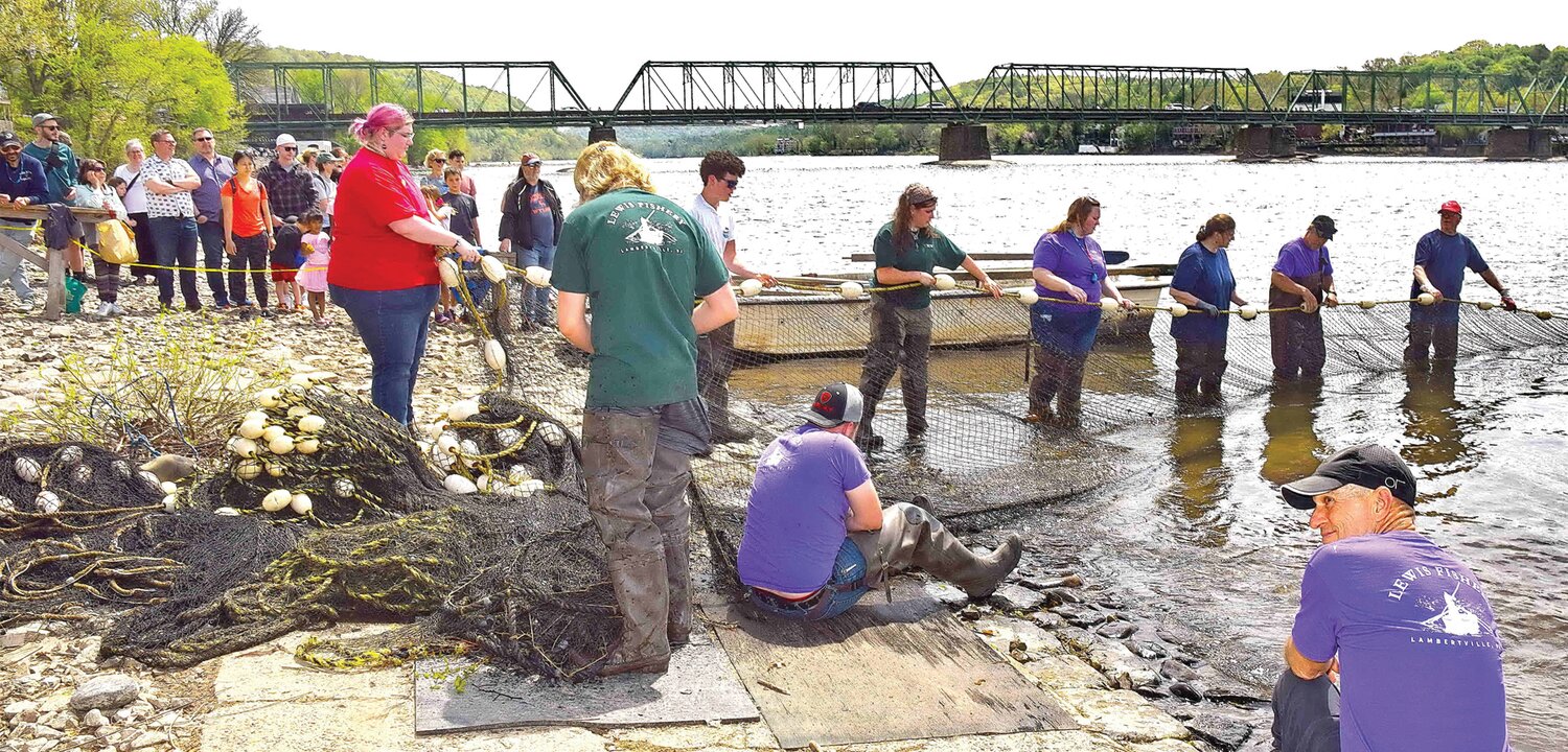 The crew brings in the nets.