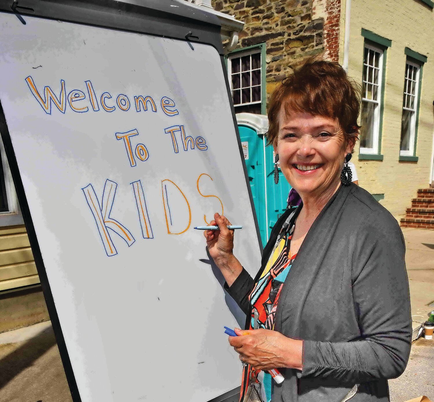 Mary Lide, one of the many volunteers, provides a helping hand at the festival.