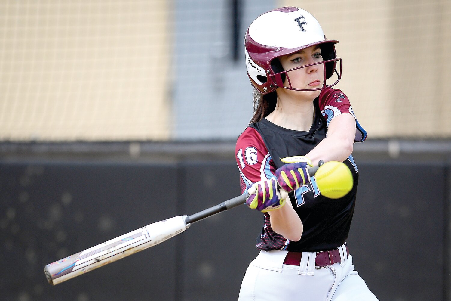 Faith Christian’s Abby Filer laces a base hit to right field.