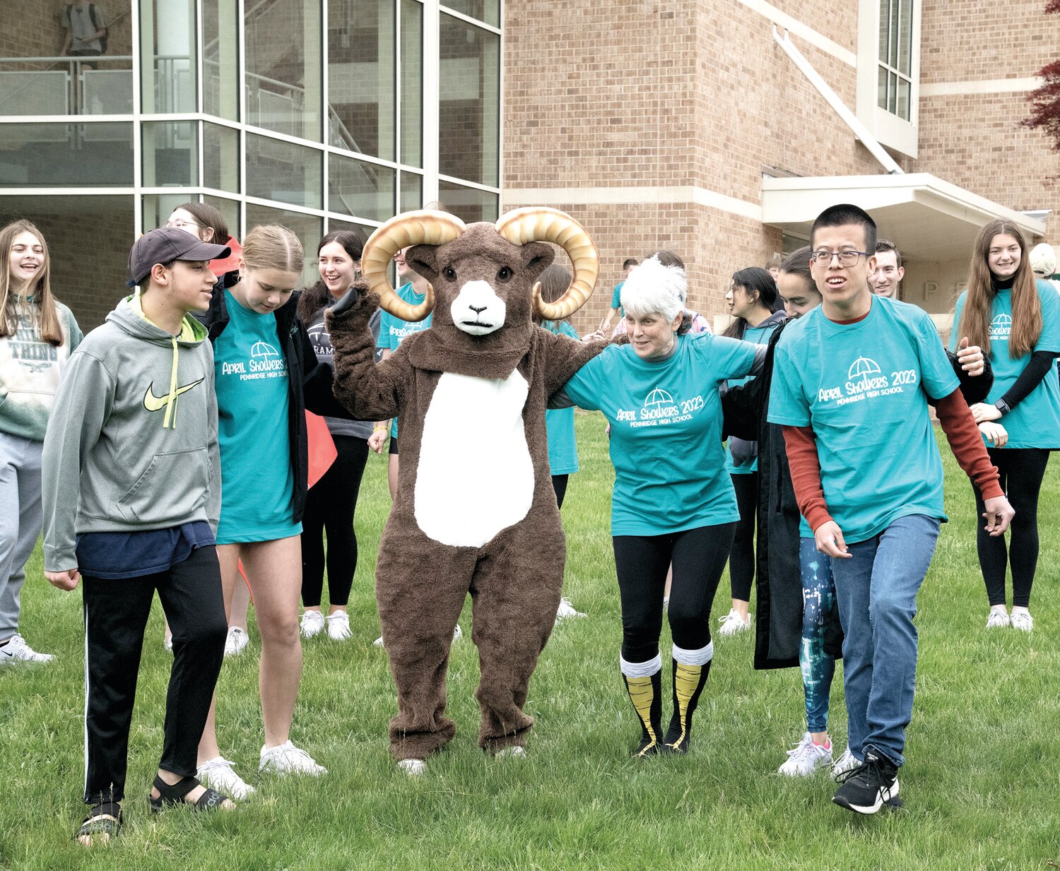 Pennridge teaching assistant Lori Bergey, along with the Rams mascot, kicks up her heels with some of her students. Friday was her last day at the school, as she will be taking on different teaching responsibilities in the district.