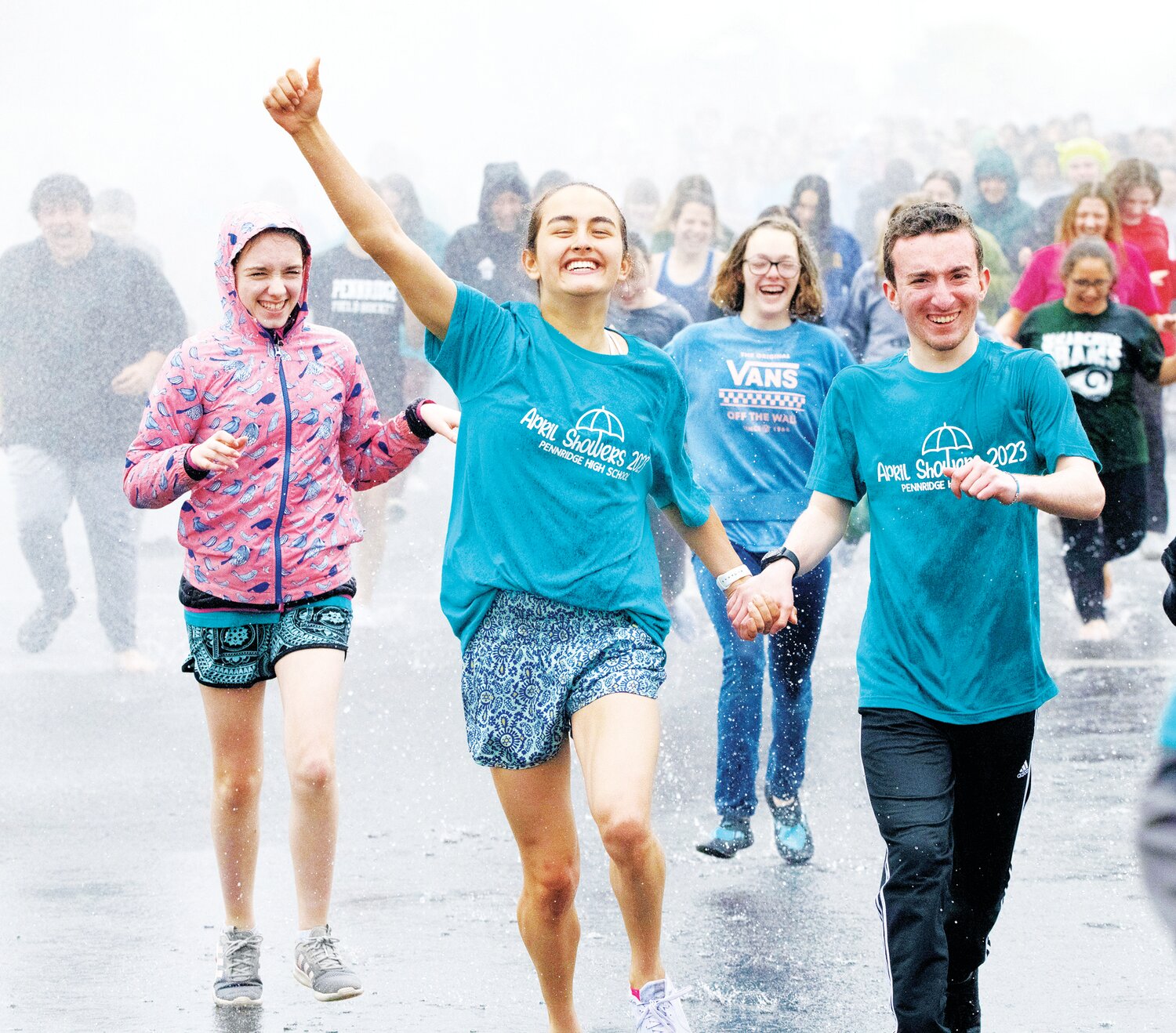 Wet runners head for the finish line.