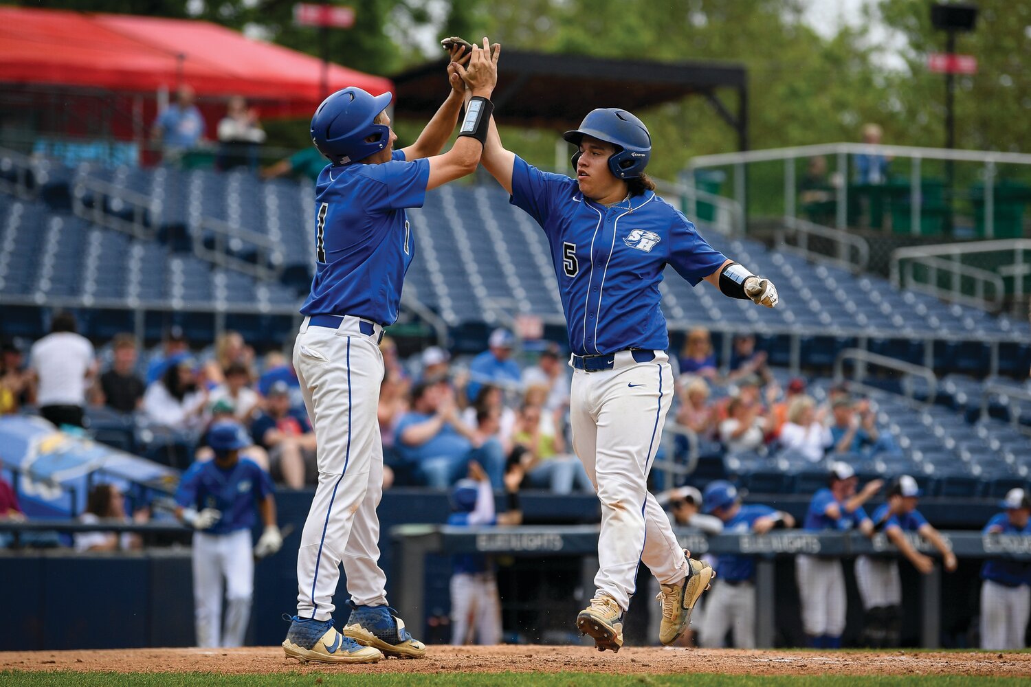 South Hunterdon’s Jack Godown greets Cooper Currie after South Hunterdon plated two unearned runs in the bottom of the fifth inning.