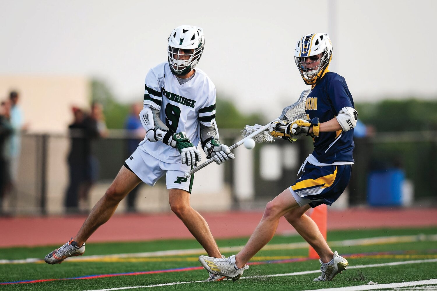 Pennridge’s Ryan Carickhoff tries to keep the ball in play as Wissahickon’s Matt Bauer closes in.