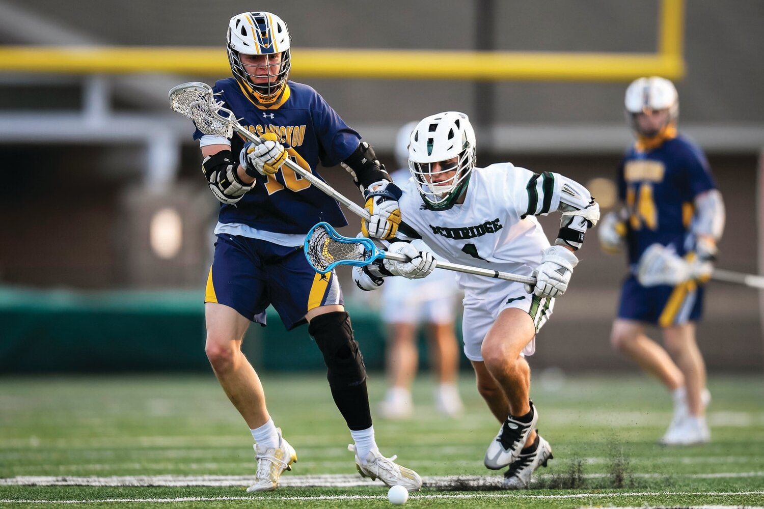 Pennridge’s Levi Souder and Wissahickon’s Gavin Myersbattle for a loose ball during the second period.