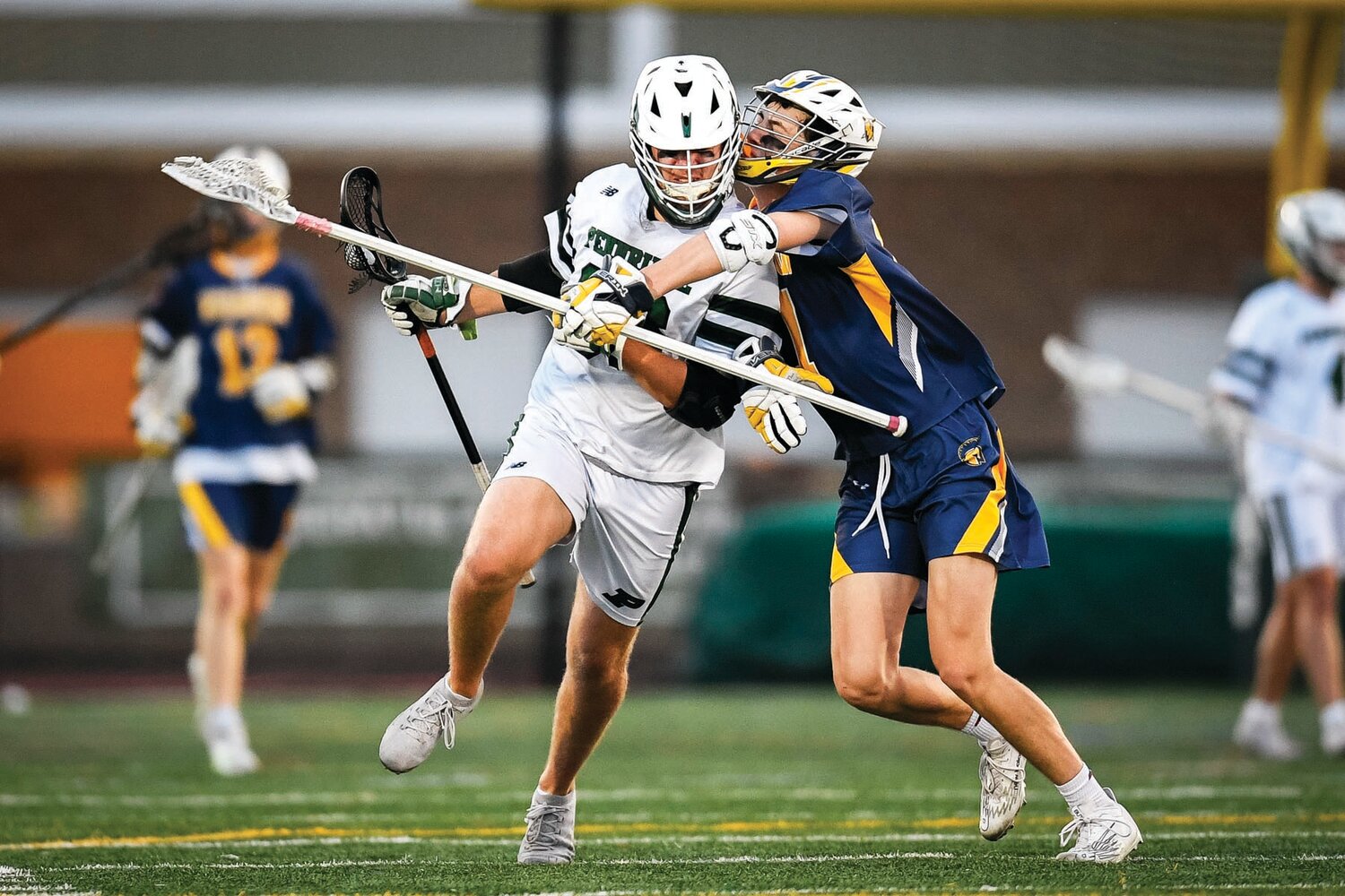 Pennridge’s Ben Souder tries to get around the grasp of Dan Hussa at midfield.