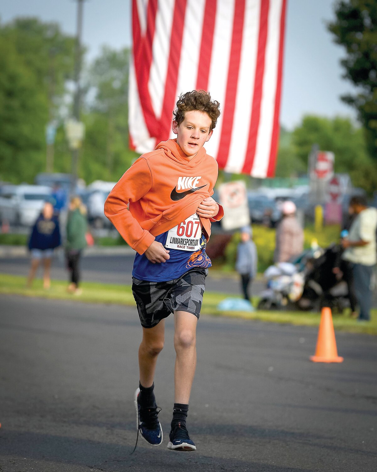 Brendan Sargent of Morrisville crosses the line first in the 1-mile race with a time of 6:57.