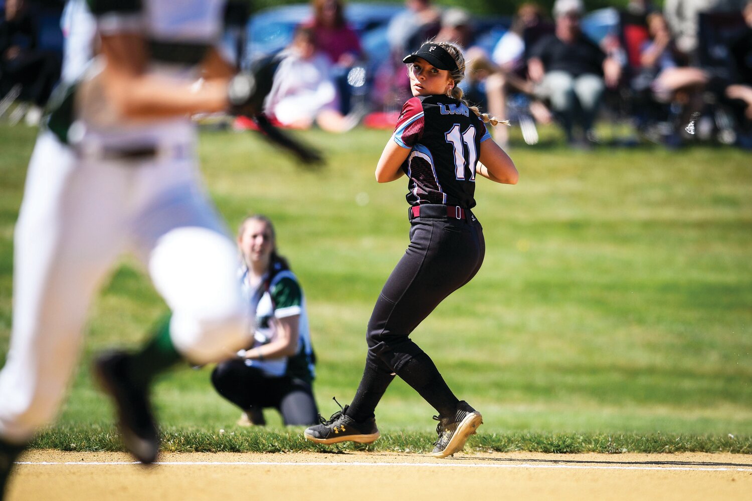 Faith Christian third baseman Jocey Heverly fields a grounder in the bottom of the fourth inning.