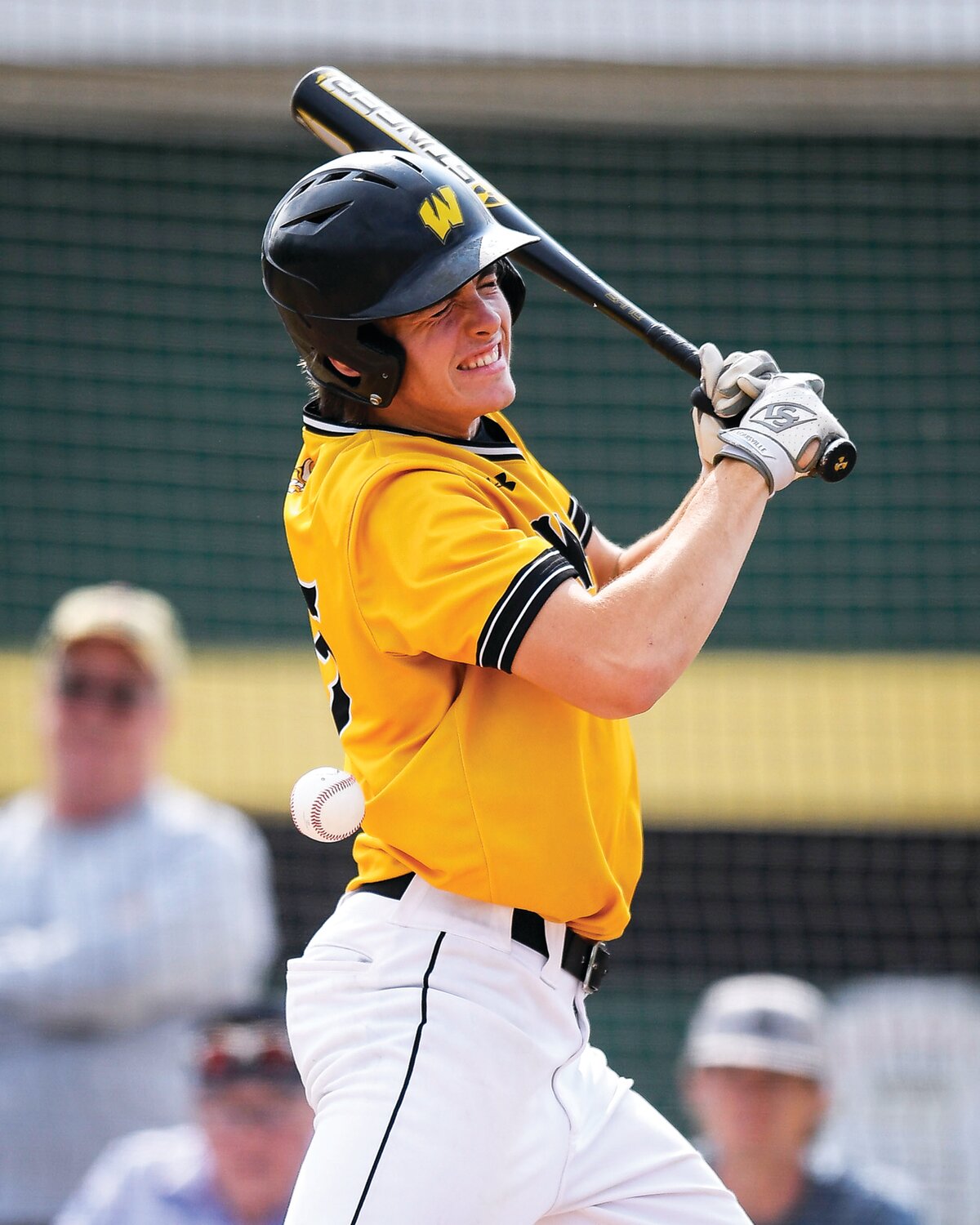 Archbishop Wood’s Jared Uzdzienski takes a ball from Pope John Paul II pitcher AJ Diaddezio square in the ribs during the Vikings’ nine-run first inning.