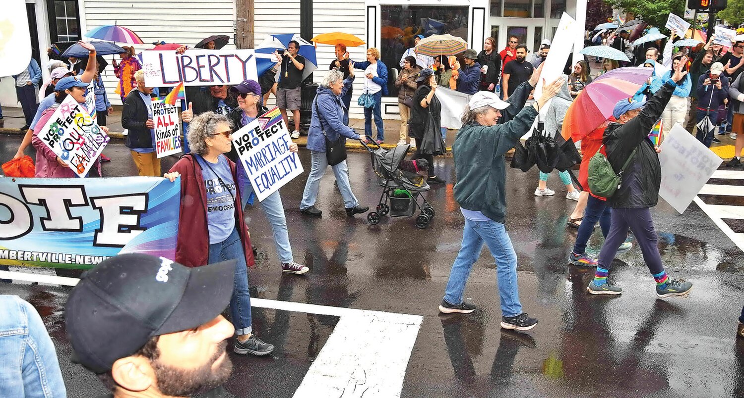 Parade participants march through New Hope.