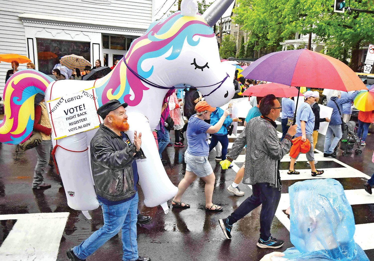 Parade participants march through New Hope.