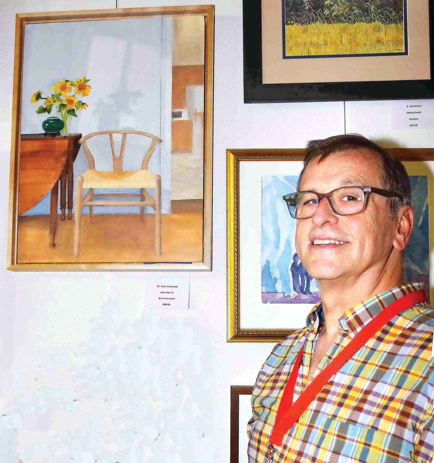 Gene Underwood next to his oil on linen panel, “September 21.”