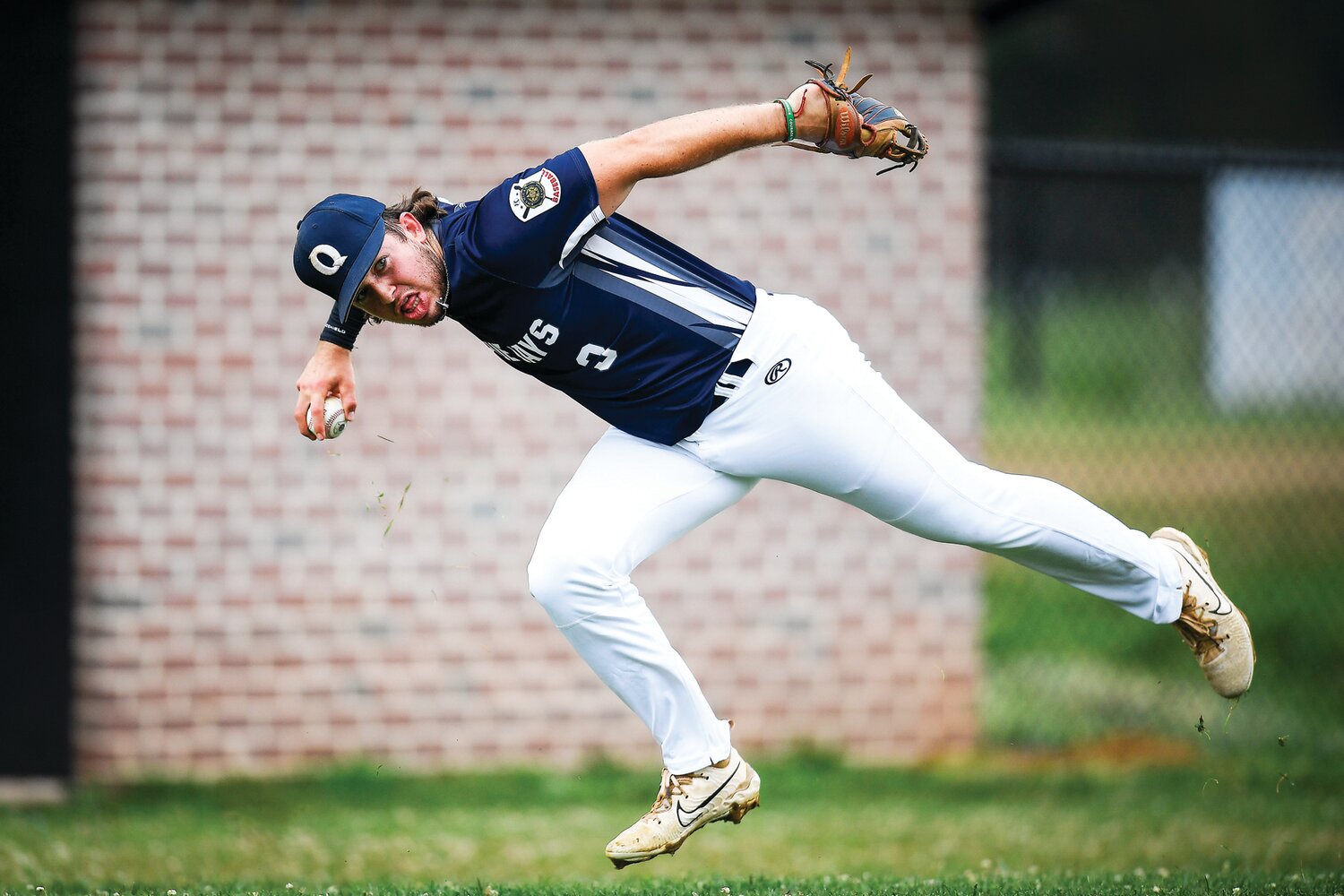 Quakertown third basemen Ty Everitt fields a bunt by Nor-Gwyn’s Jeremiah Criger on the first play of the game Monday.