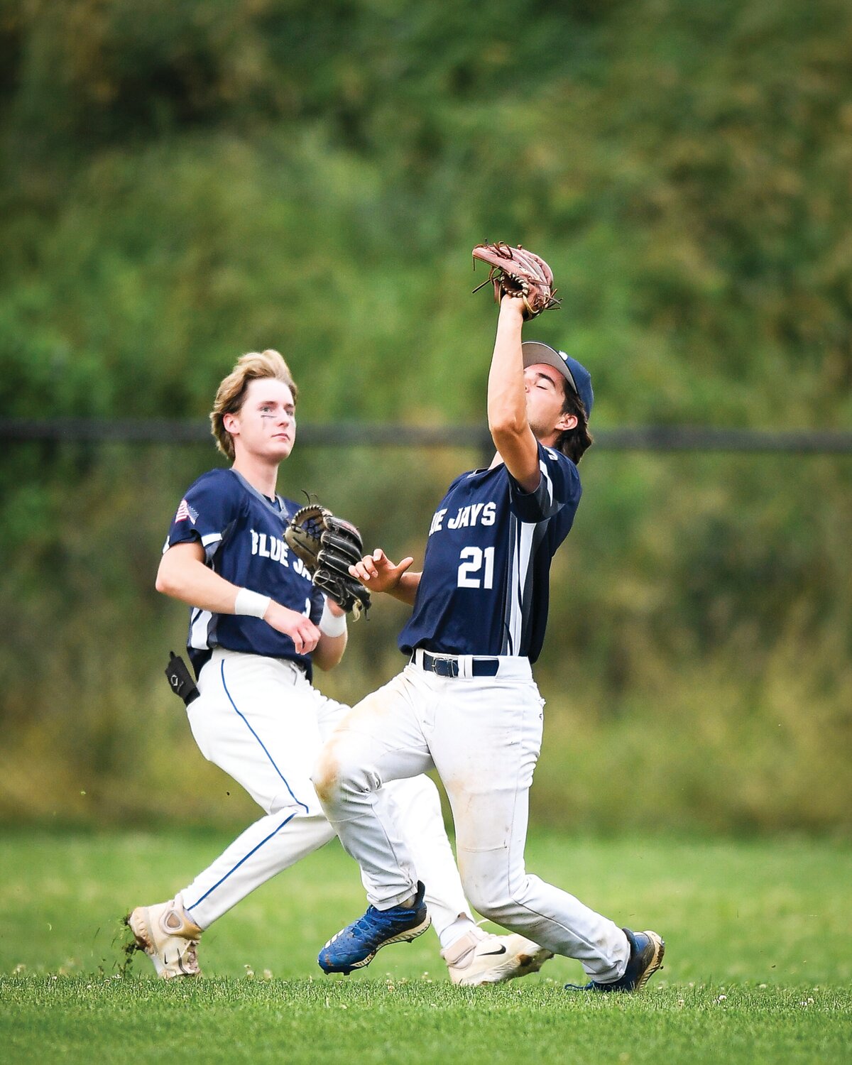 Quakertown center fielder Peyton Myers makes a catch on a short fly ball in the top of the first inning.