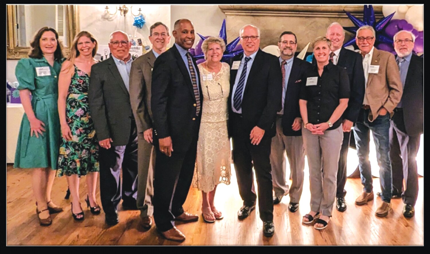 Past EMCCC presidents and staff pay tribute to Wendy Klinghoffer; from left are: Nancy Ischinger, Rachel Laird, Russell Koerwer, Marty Kalos, Leon Singletary, Wendy and Neil Klinghoffer, Tom Cox, Pam Sawyer, Robert Maher, Dave Peterson and Gary Kozick.