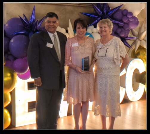 Mary Ann Murtha accepts the Volunteer of the Year Award from John Dean and Wendy Klinghoffer.