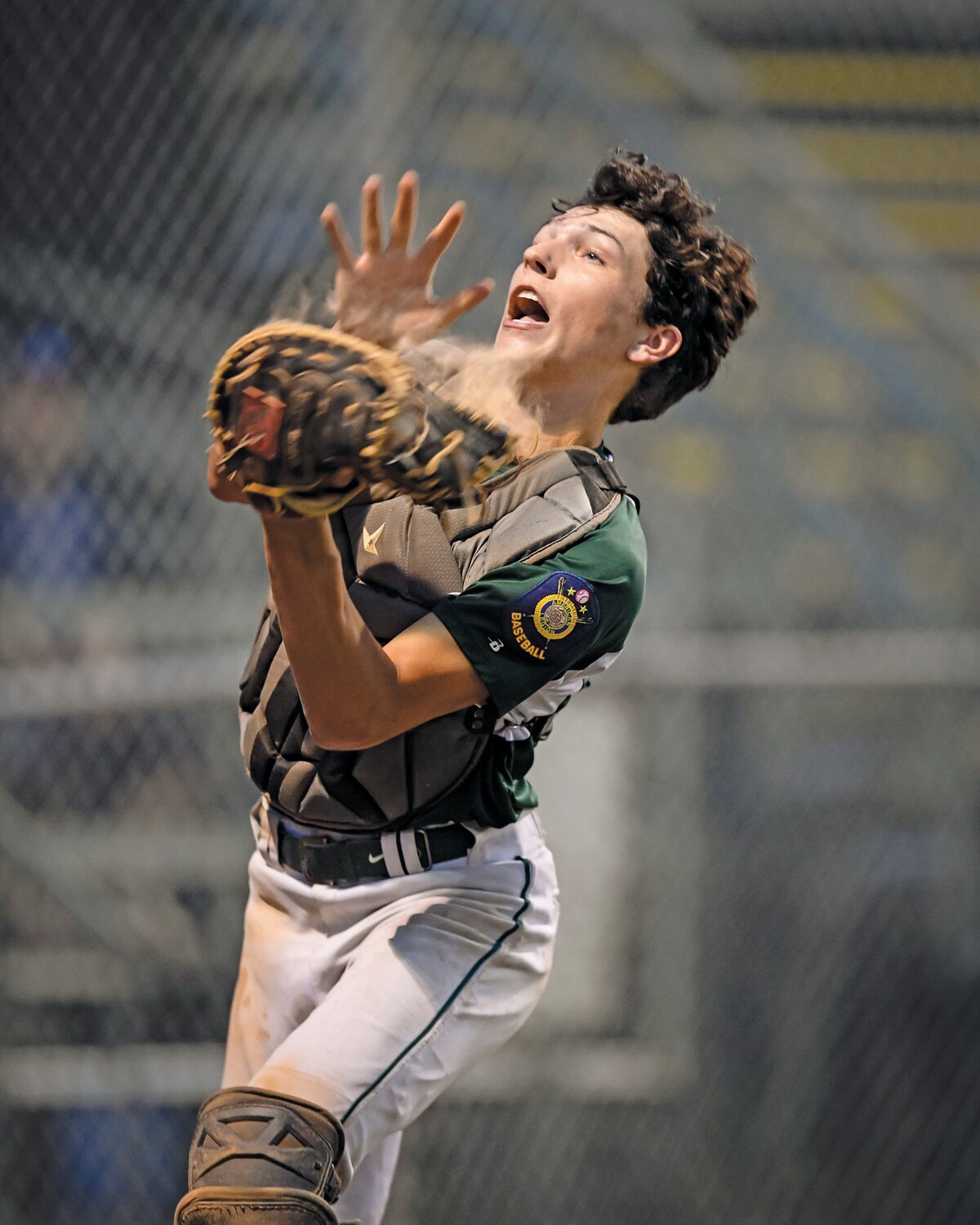 Pennridge catcher Joe Santora catches a foul popup close to the Quakertown dugout during the top of the fourth inning.