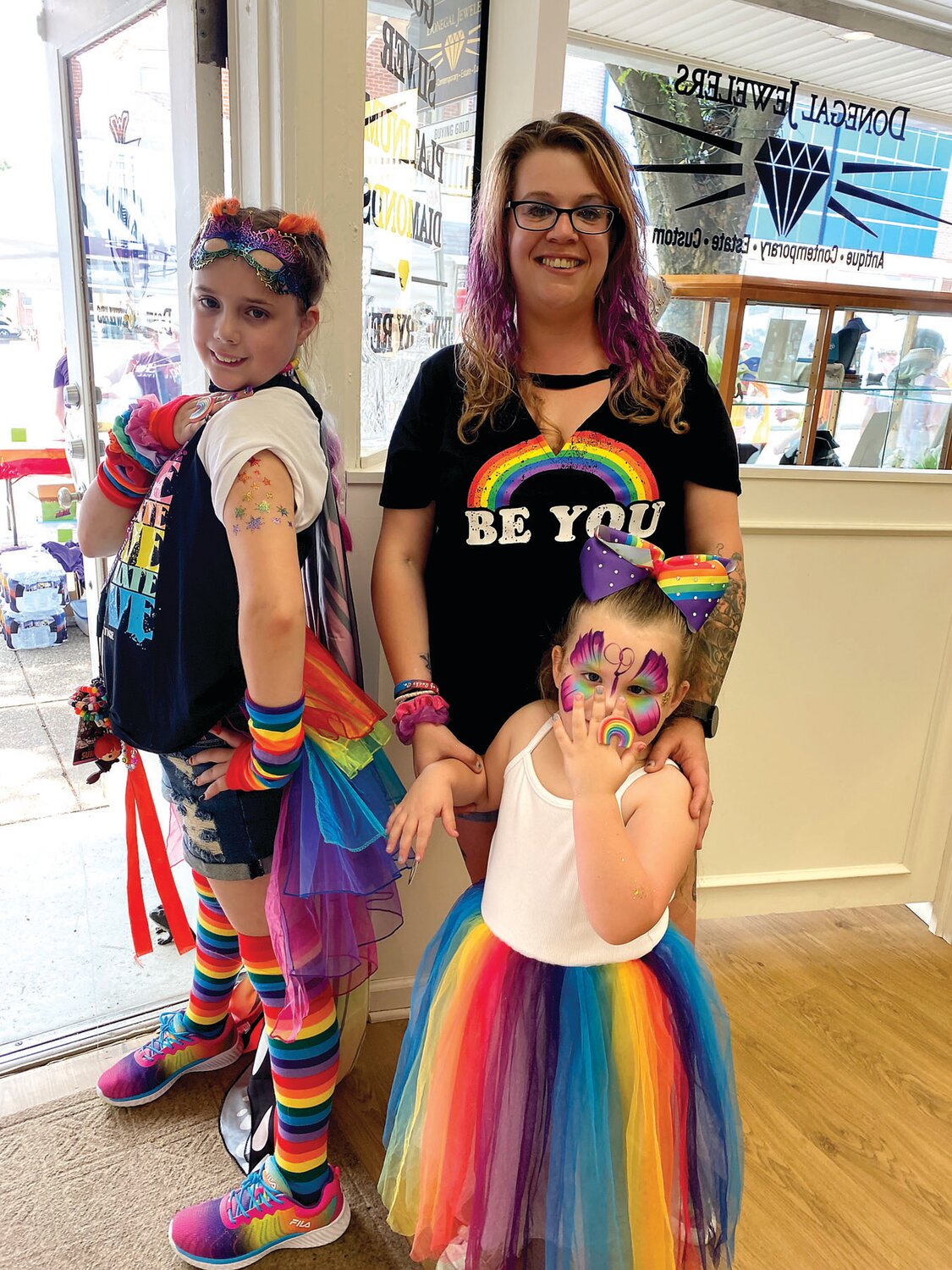 Leah Bates and her daughters, Isabella Jackman, 12, and Harley Bates, 3, celebrate in a rainbow of colors.