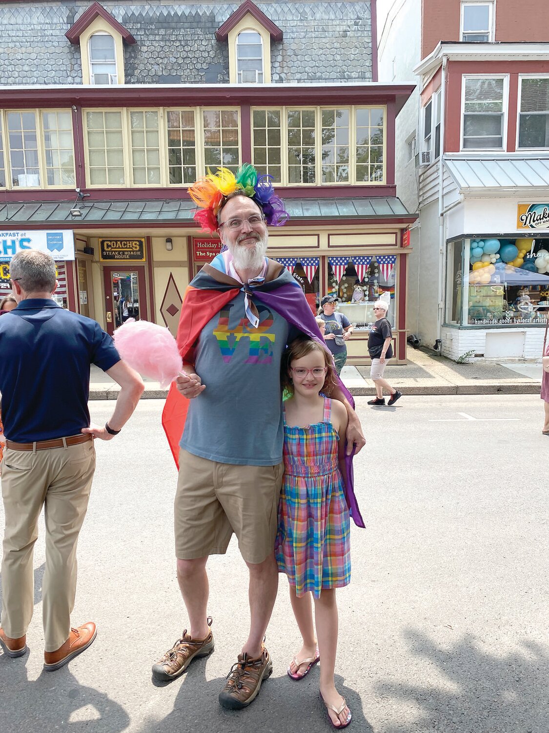 John Huber and his daughter, Zinnia, join in the festivities.