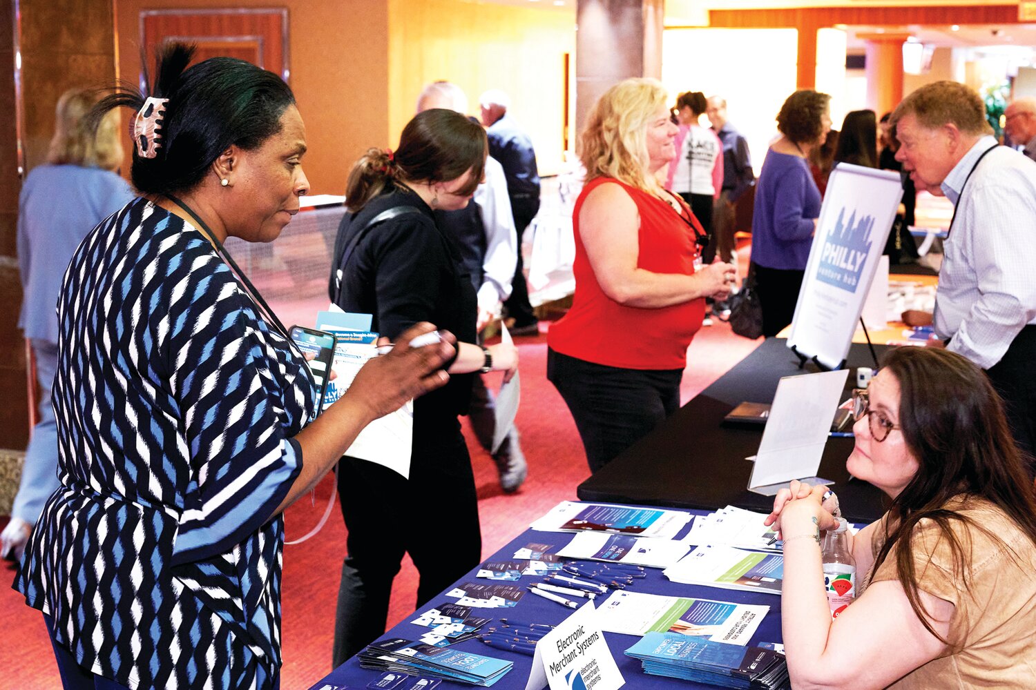 SCORE Bucks County’s Women Building Businesses conference attendees visit the seven exhibitor tables.