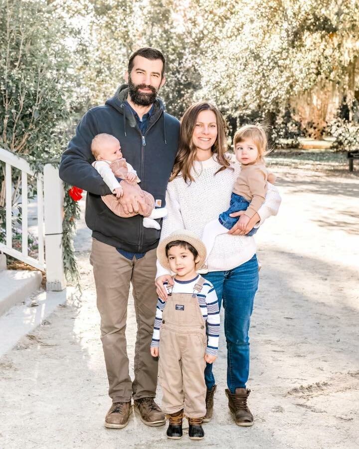 Portrait of the Sheils family, including father Jim, mother Katie Seley, their 4-year-old son, 2-year-old Mattie, and 9-month-old Conrad.