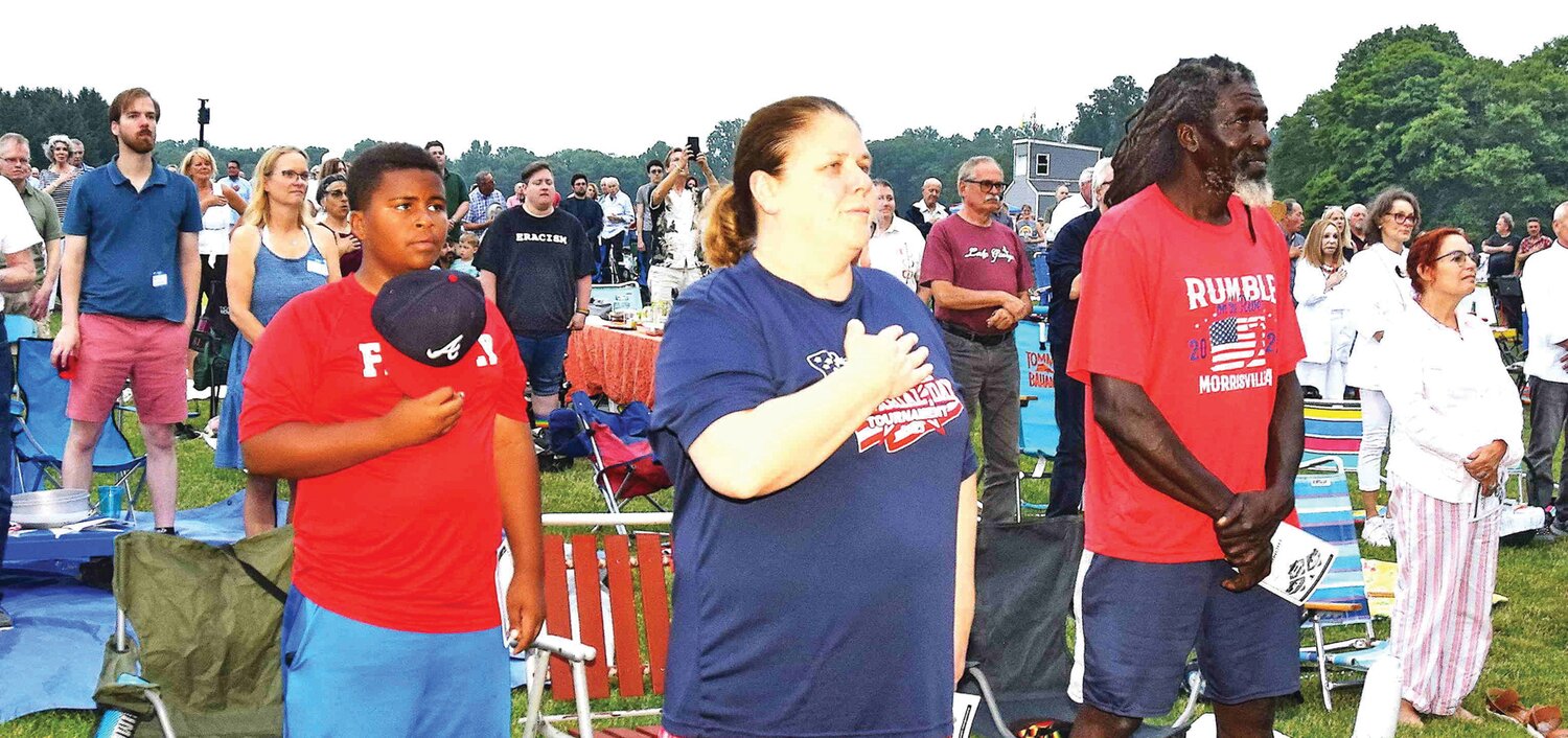 Concert goers during the national anthem.