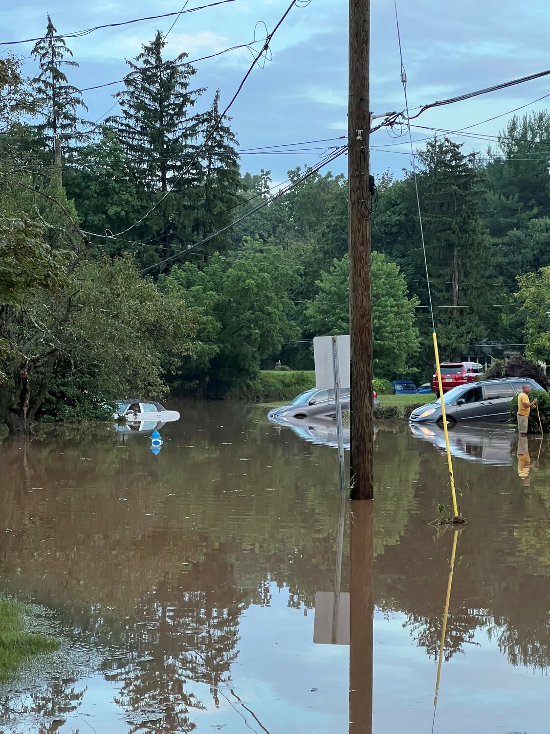 Submerged and partially submerged vehicles abounded last week in the close-knit community of Maplevale and Meadow drives in Lower Makefield, following a July 15 flood.