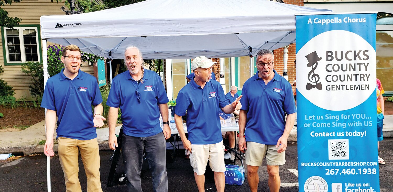 Members of the Bucks County Country Gentlemen sing a cappella on West State Street in Doylestown.