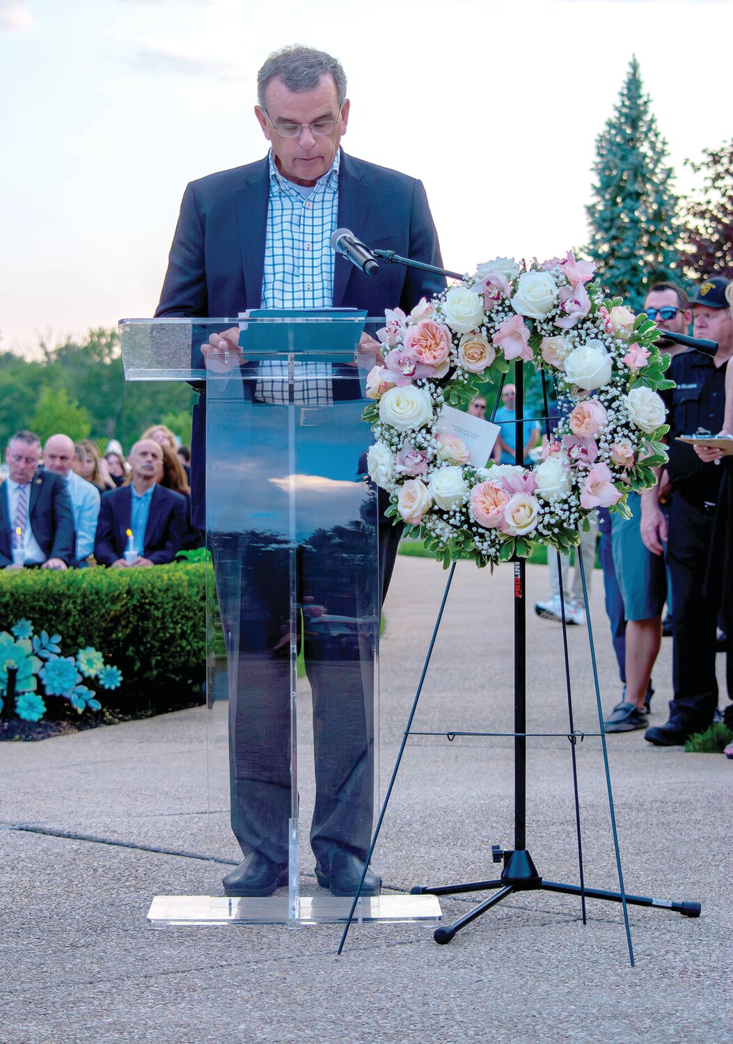 Paul Sheils, grandfather of Mattie and Conrad Sheils and father of Jim Sheils, speaks at the vigil.