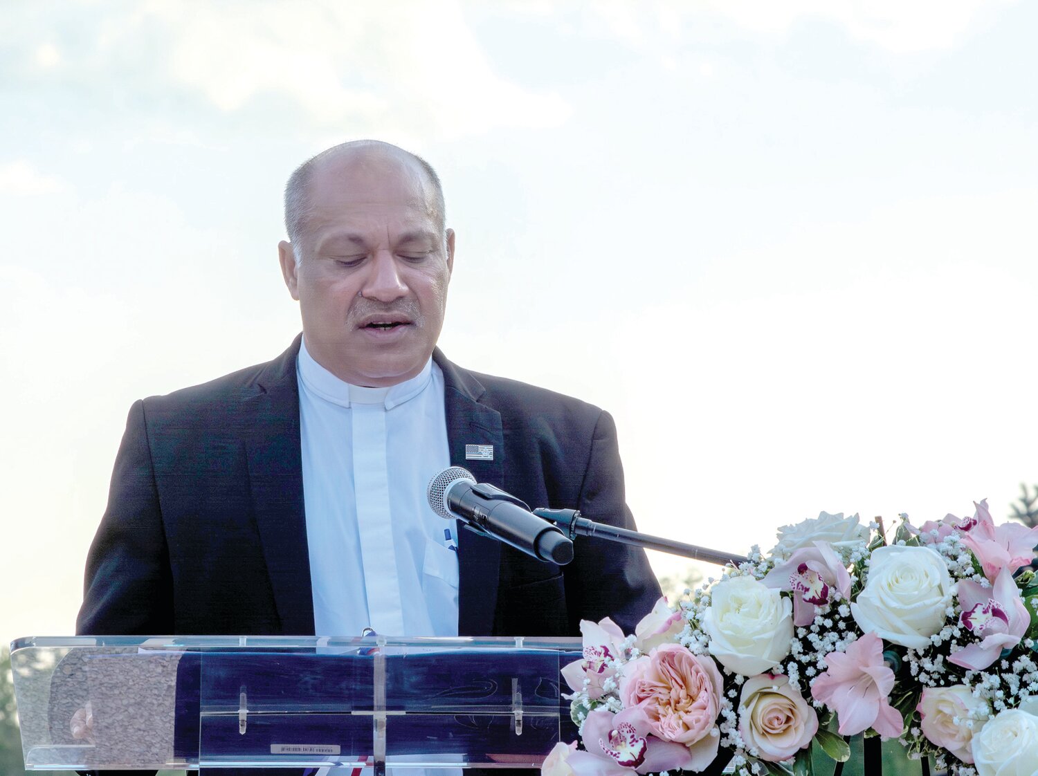 The Rev. Heeralal Mukesh Cheedie, pastor of Redeemer Lutheran Church in Penndel, offers a prayer during the vigil.