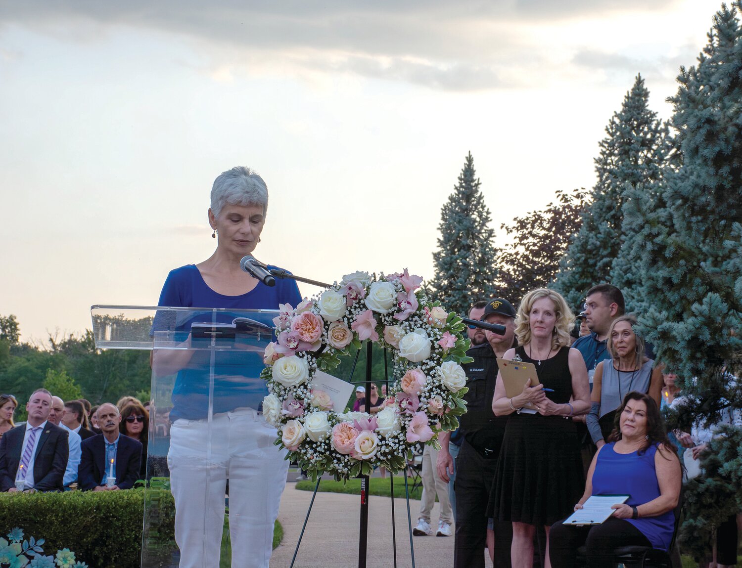 Dahlia Galindez, grandmother of Mattie and Conrad Sheils and mother of Katie Seley, speaks at the vigil.